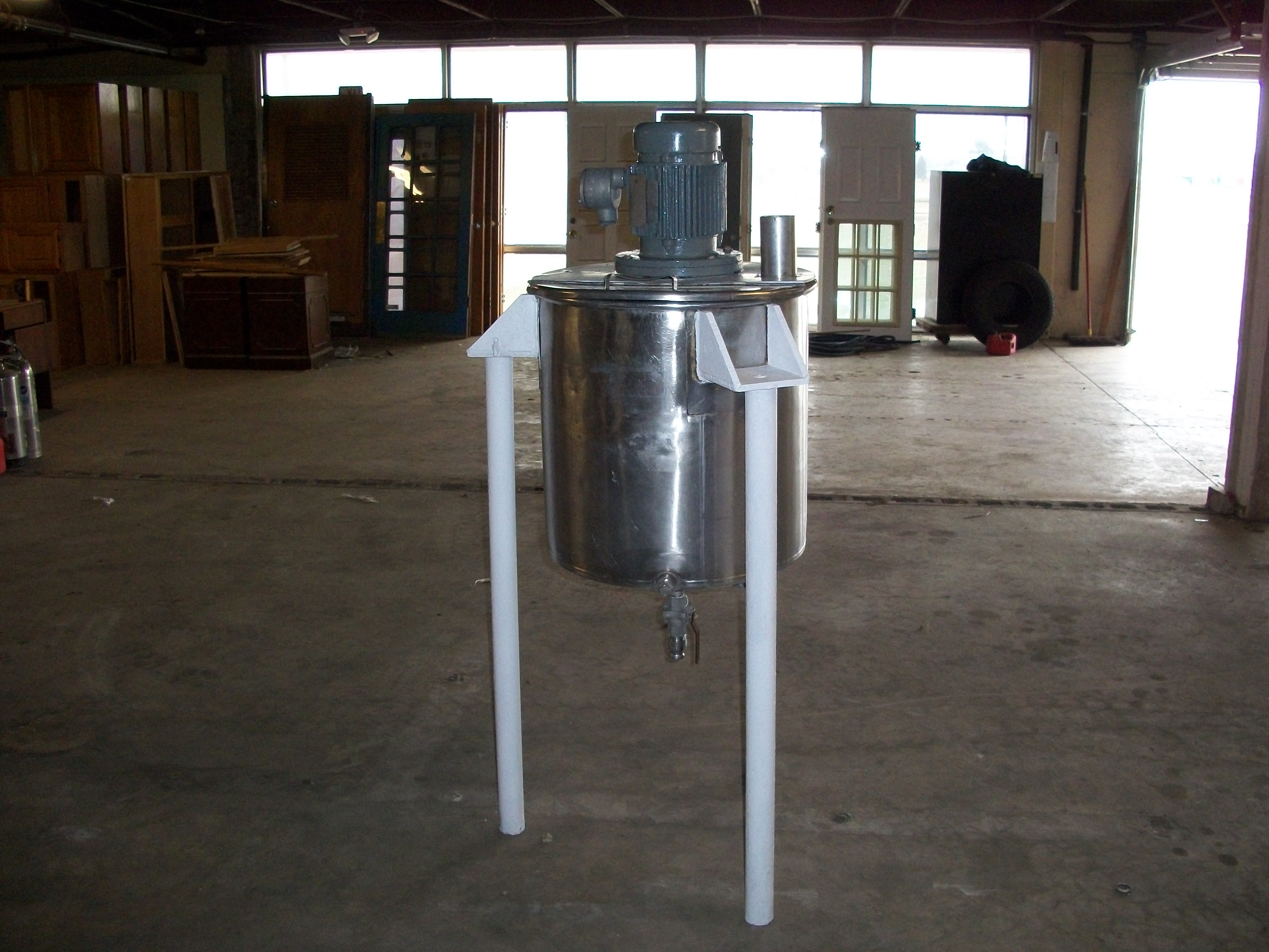 Used approximately 50 gallon stainless steel vertical mix tank